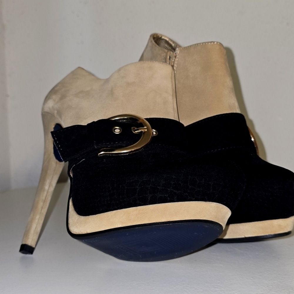 Sleek Black and Tan Heeled Boots with Stiletto Heels